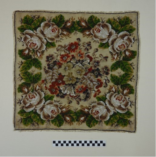 Berlin work panel using applied glass bead and hand embroidery with woollen threads (1860&rsquo;s; TRC 2008.0433).