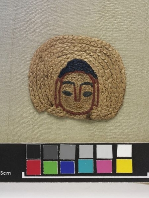 Silk embroidery of Buddha head, from Dunhuang, China, c. 8th century.