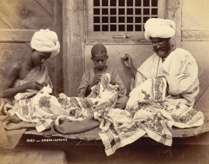 Photograph of three carpet embroiders from Jammu and Kashmir, 1890's.