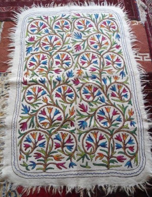Example of a felt namdha floor covering with chain stitch embroidery. Kashmir.