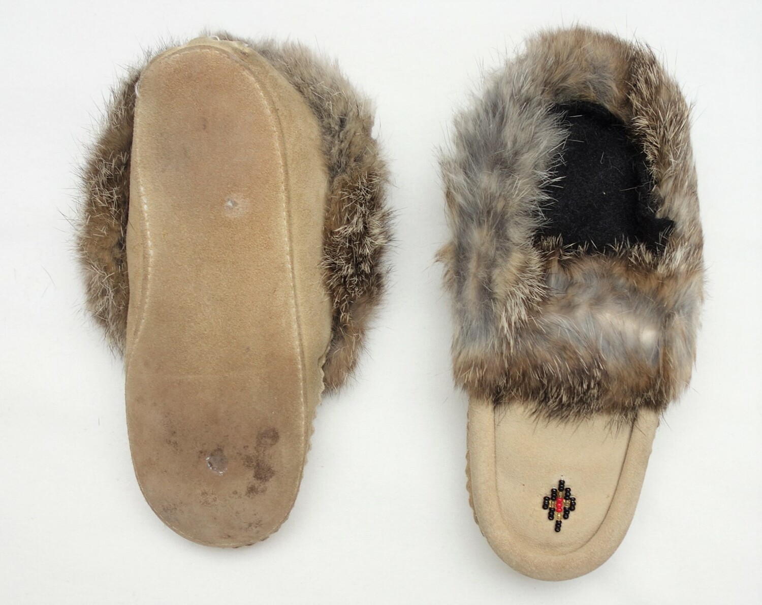 Embroidered mocassins produced and worn by Canadian Inuit, late 20th century (TRC 2009.0261a-b).