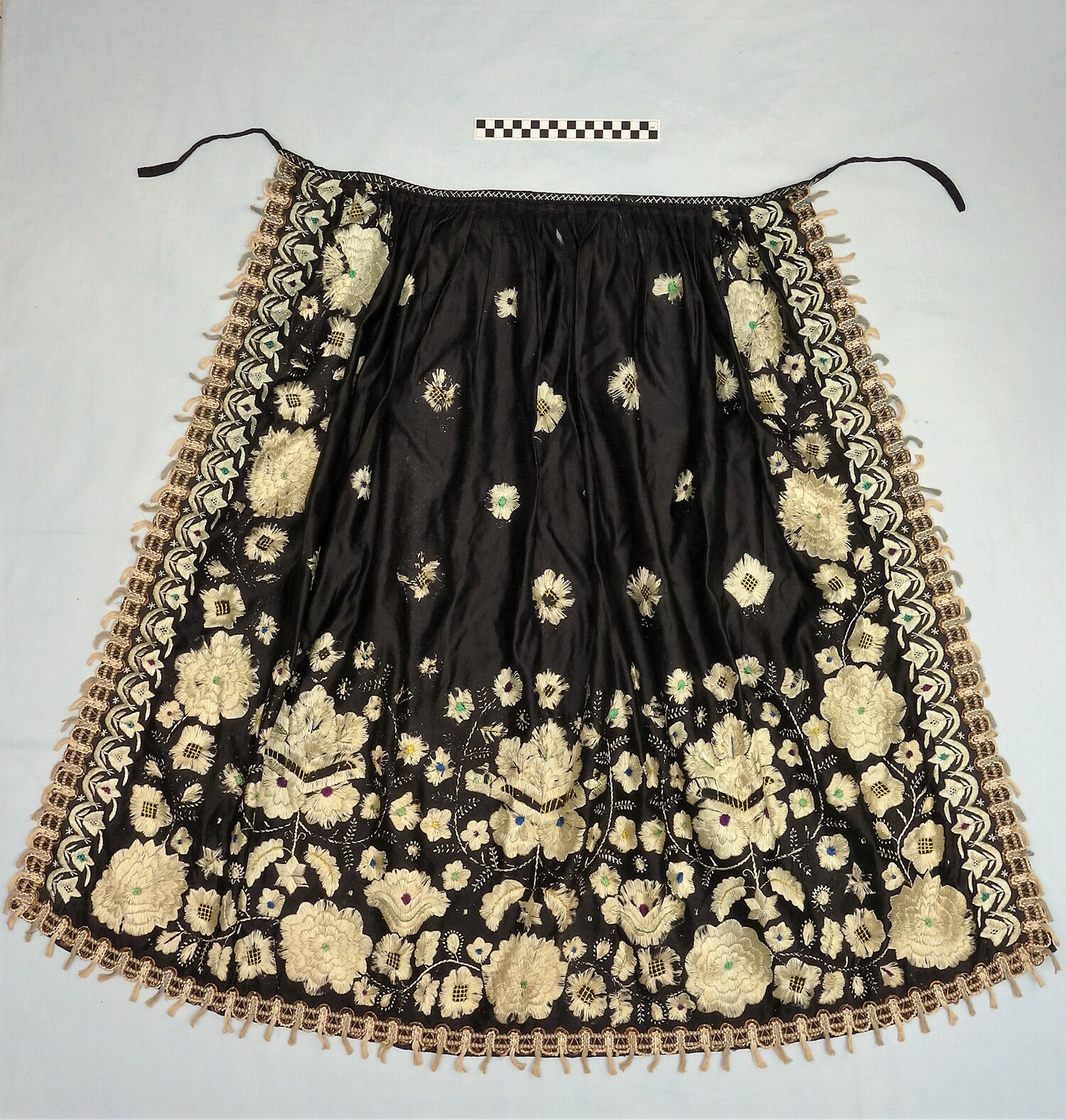 Fig. 8. A twentieth-century, long, black satin Sunday apron from Germany (TRC 2016.0919).