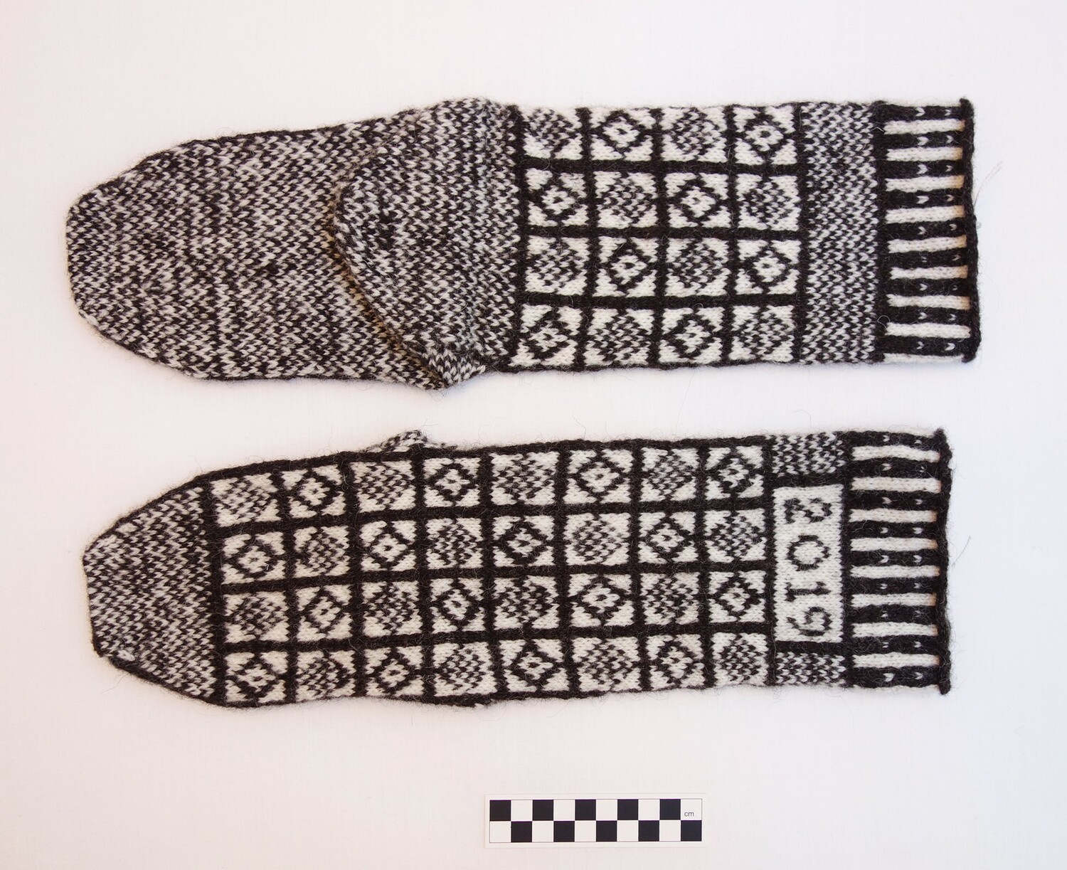 Fig. 1. Pair of Sanquhar hand knitted socks, 2019 (TRC 2019.0274a-b).