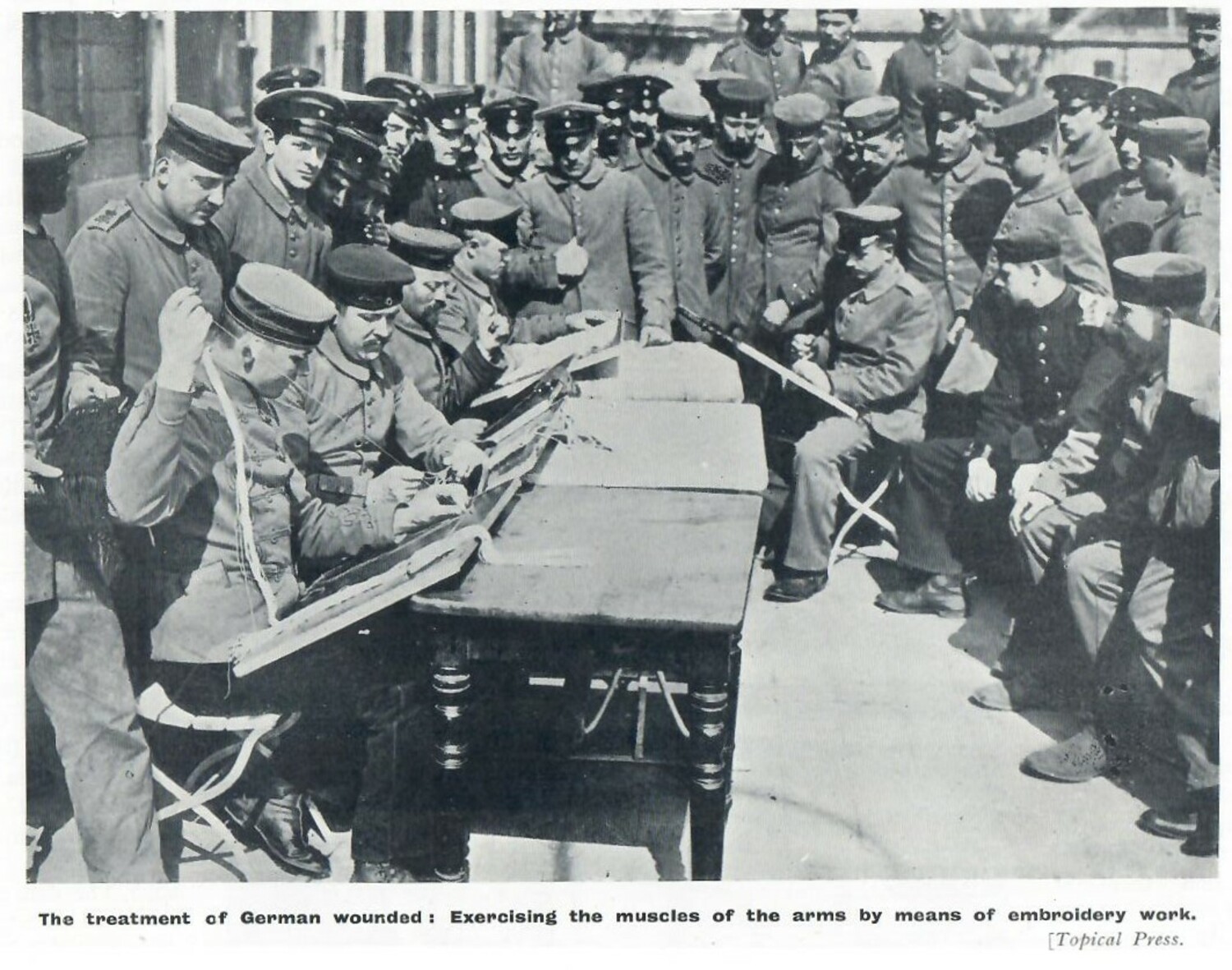 'The treatment of German wounded: Exercising the muscles of the arms by means of embroidery.' The Manchester Guardian 1915. (TRC 2021.1342).