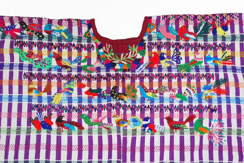 Detail of a woman’s huipil from Guatemala with embroidered birds (1960s, TRC 2021.1970).
