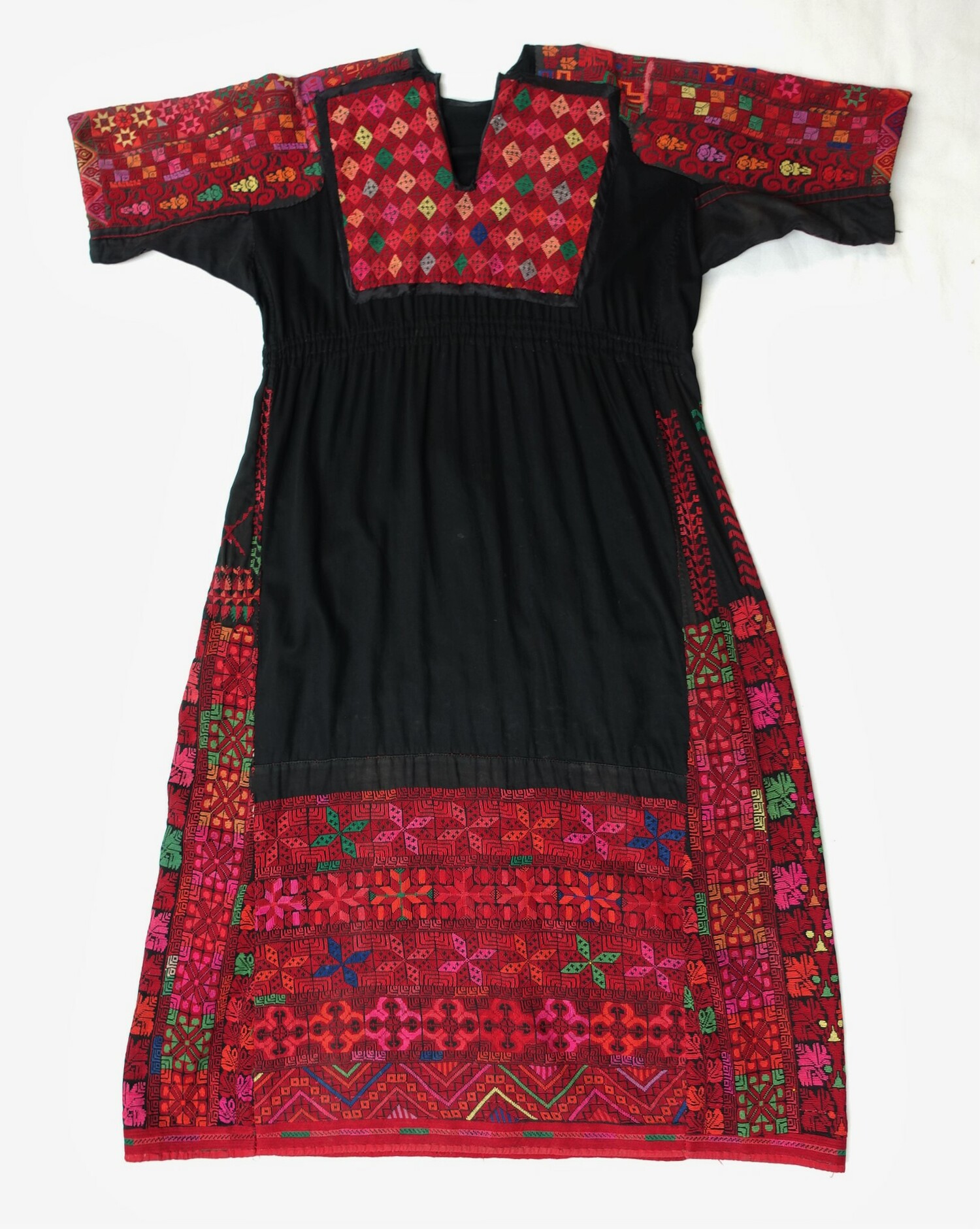 Embroidered Palestinian dress which is made up of at least four different garments, probably for the tourist market, second half 20th century (TRC 2021.3351).