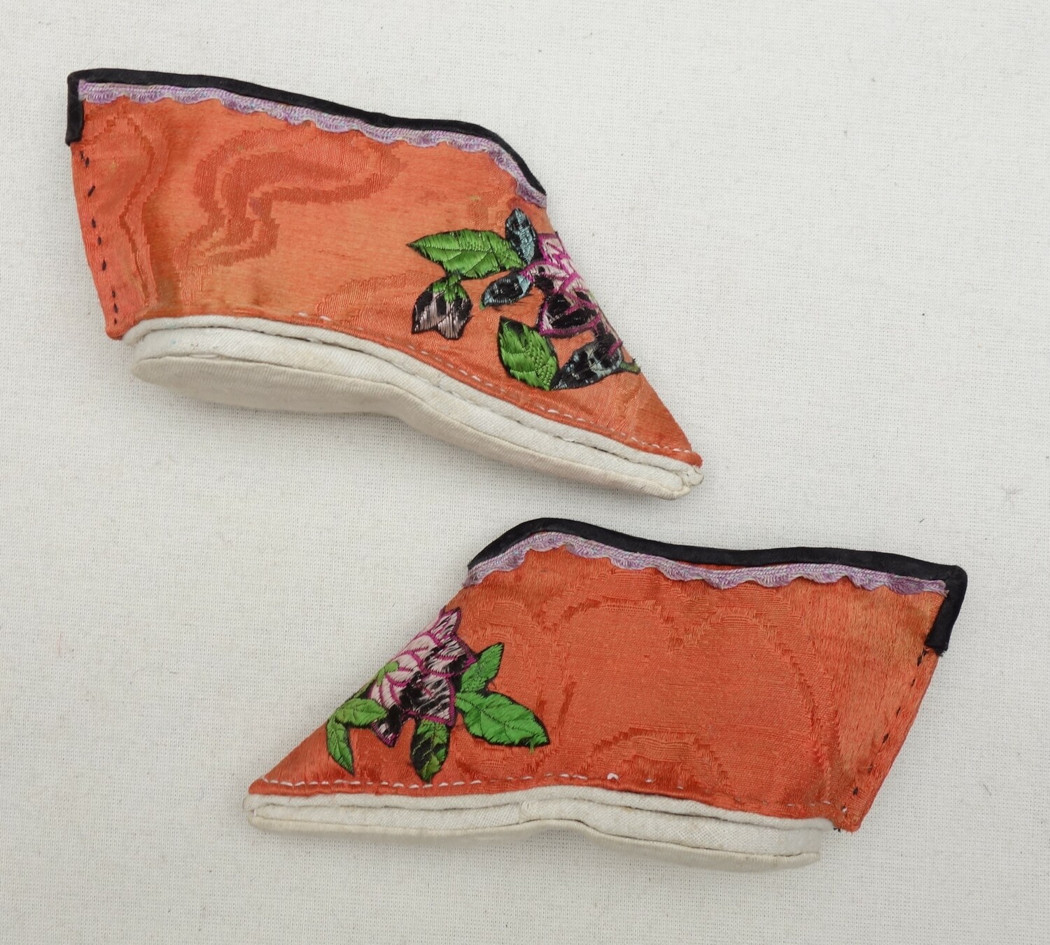 Pair of lotus shoes for the tourist market, early 21st century (TRC 2023.1264a-b).