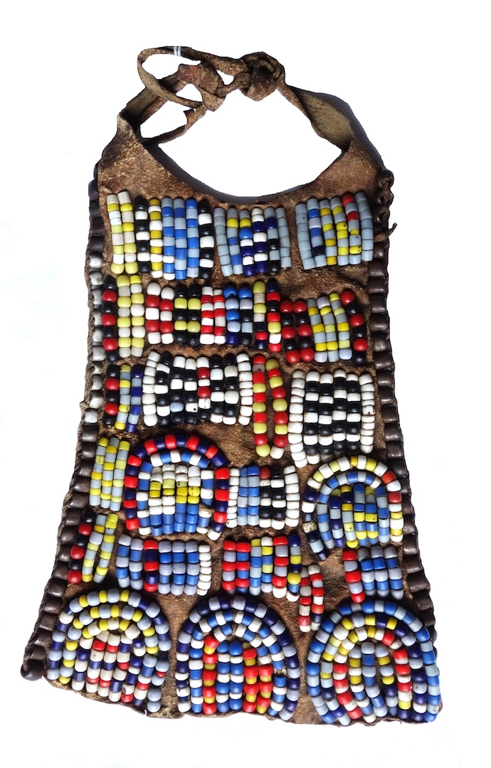 Fig. 4. Short, leather apron decorated with lines and blocks of beads in brown, grey, yellow, black, white, red and blue. Kenya, Turkana, late 20th century (TRC 2026.0192).