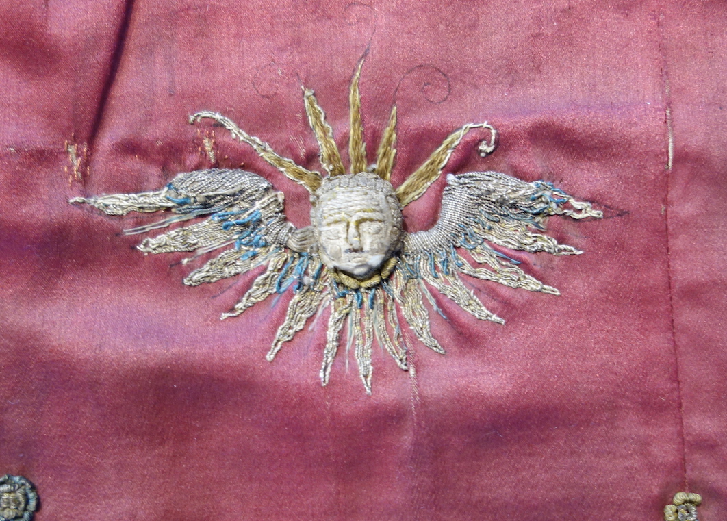 Detail of an early 17th century cope, with stumpwork cherub, made for the Bishop of Durham on the occasion of a visit by King Charles I in 1633. Durham Cathedral. Photograph by author.