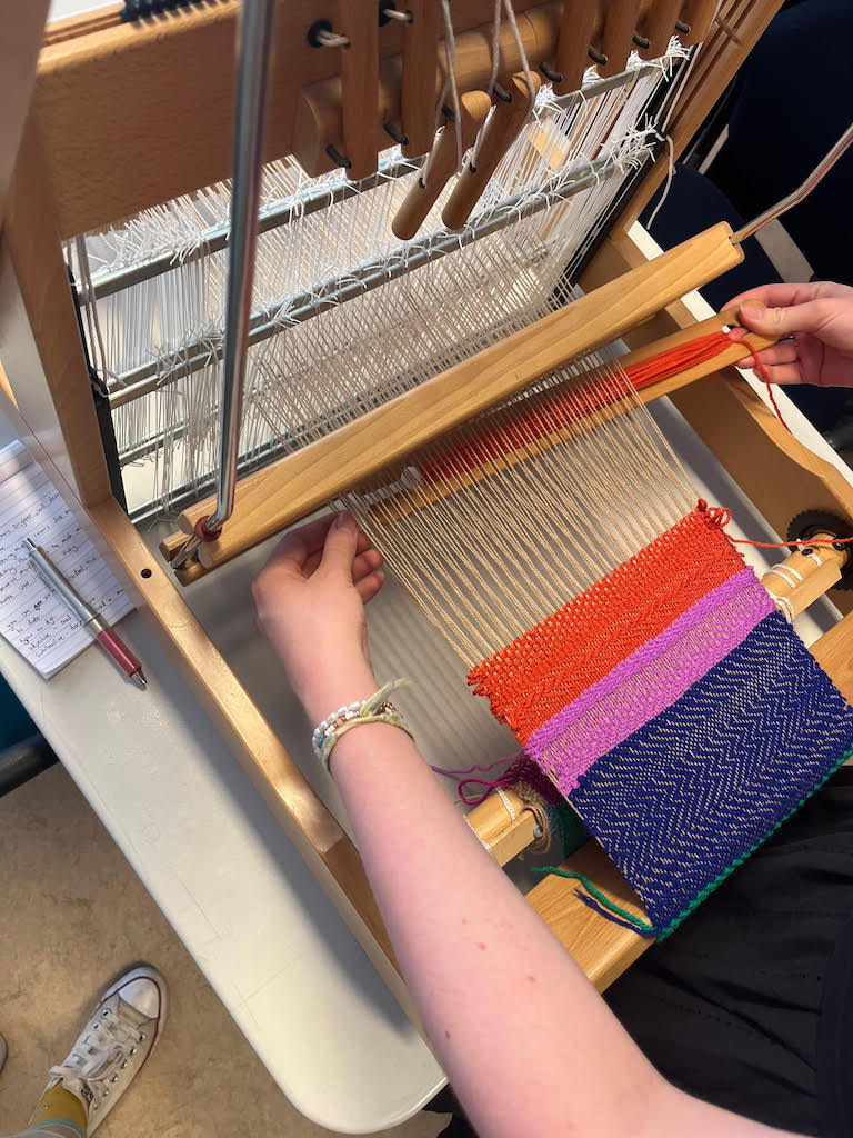 Practising the craft of weaving. Photograph by author.