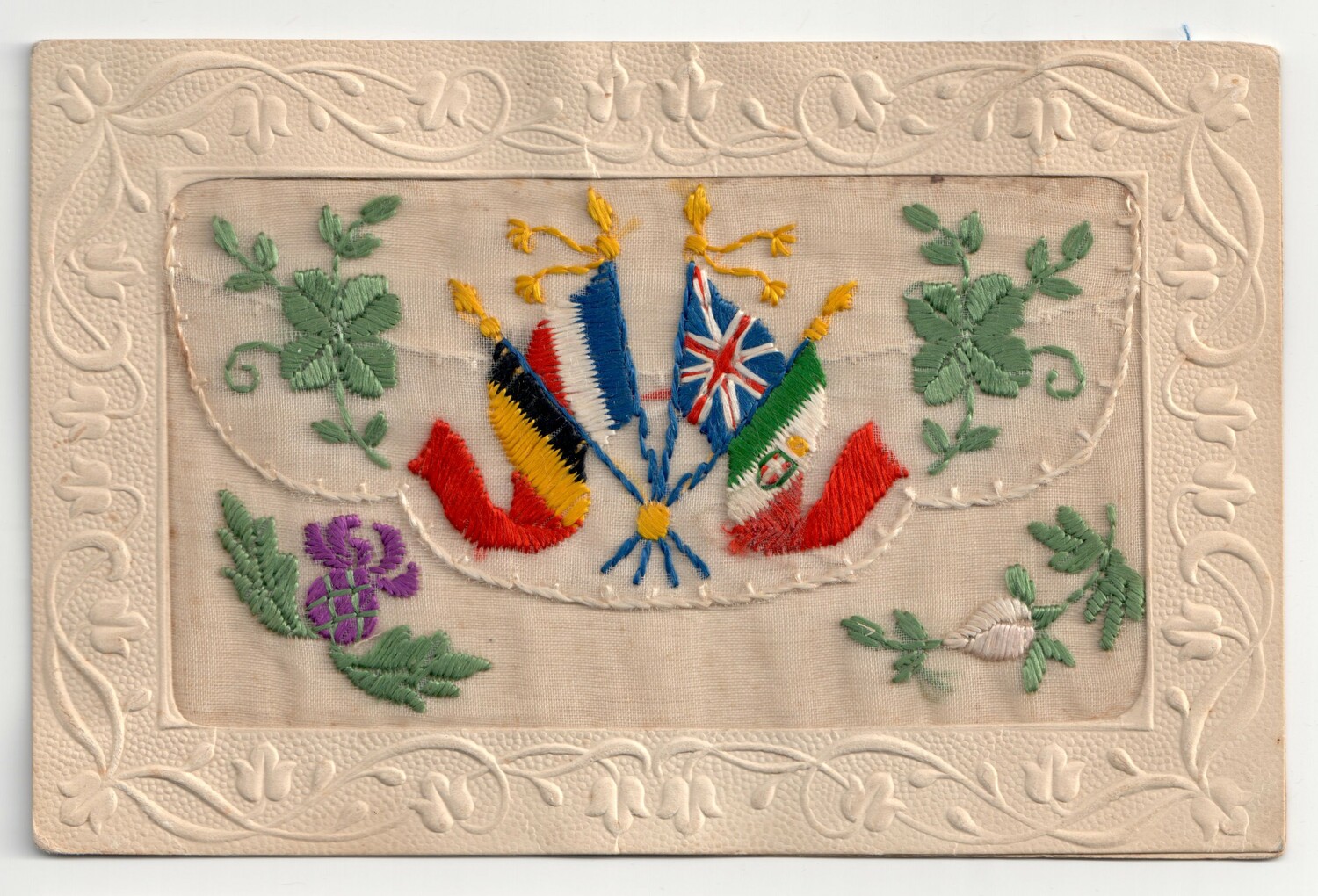 Embroidered postcard from the First World War, with the Belgian, British, French and Italian flags (TRC 2015.0419).