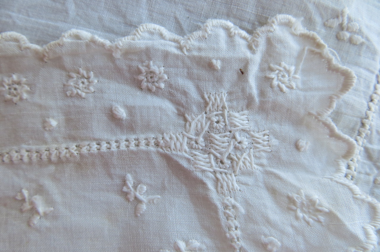 Detail of embroidered handkerchief (TRC 2022.2726b), found inside a pocket in 19th century skirt TRC 2022.2726a.