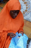Fatima Haruna at work on a piece of Hausa embroidery. She was one of the embroiderers who worked on the samplers (2018; photograph by courtesy of Hassana Yusuf, Queen Amina Embroidery).
