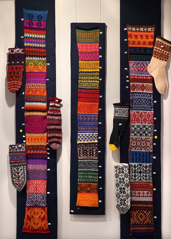 Three hand knitted samplers of designs from socks around the world. Socks&Stockings exhibition, TRC, 2019. Photograph by Joost Kolkman.
