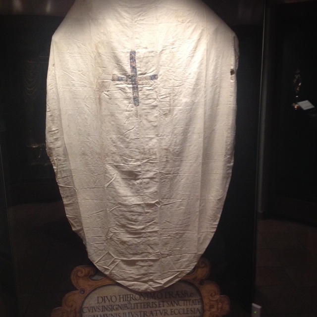 Linen garment, ascribed to St. Jerome (d. 420), with lampas weave decoration in the shape of a cross, housed in the Museum of the Basilica of St. Maria Maggiore, Rome.