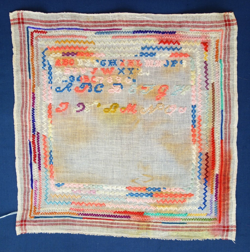 Unfinished sampler from the late 19th century, with aniline dyed embroidery threads (TRC 2020.2396).