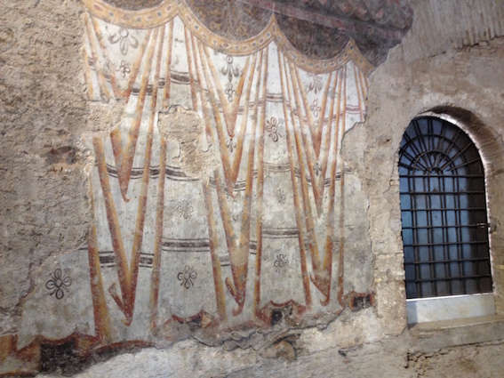 Murals in the 4th century AD Romulus temple, Rome, representing long line of wall curtains. 13th century AD.