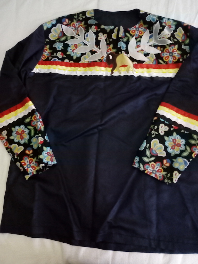 Ribbon shirt commissioned for the TRC from textile artist Jennie Kappenman.